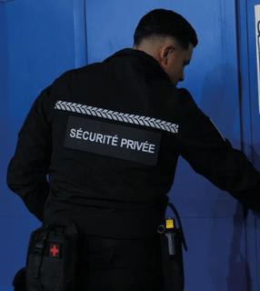 a security officer is checking the door to a security door