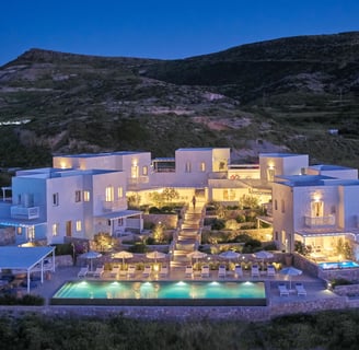 a large house with a pool and a pool Milos Breeze Boutique Hotel 