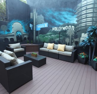 a patio with a couch and a table taken on BLVD Hotel & Studios