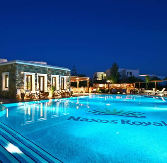 a pool with a blue sky and a blue sky from Naxos Resort Beach Hotel in Naxos