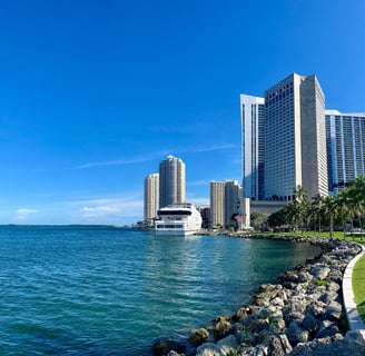 a boat in the water near a hotel, InterContinental Miami
