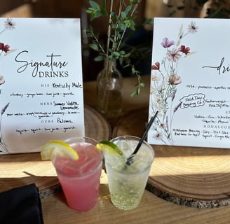 a table with a drink and a menu