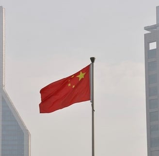 Chinese flag in front of buildings