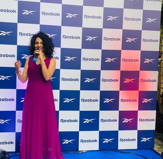 woman holding mike in an event