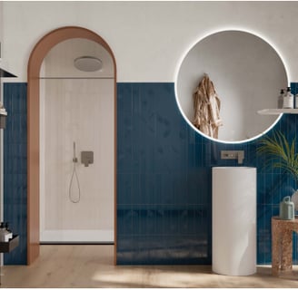 a bathroom with a round mirror and a round mirror