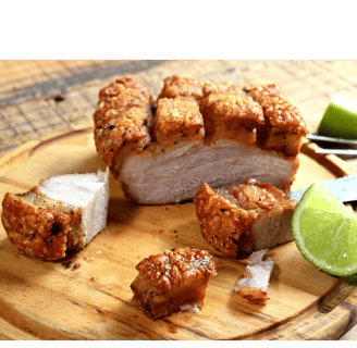 a piece of fried pork with a knife and lime wedges (chicharon)