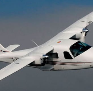 a small plane flying through the sky
