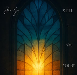 a window with a sun shining through a stained glass window