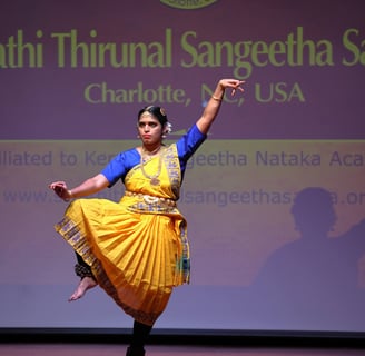 a woman in a yellow dress is performing a dance
