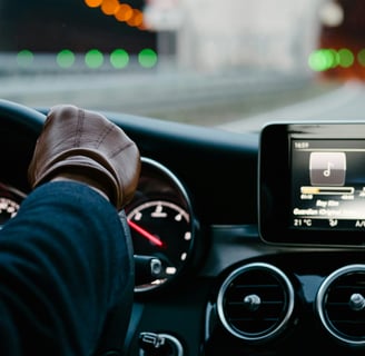 a rideshare driver driving a car with a tablet on the dashboard, what is ridesharing