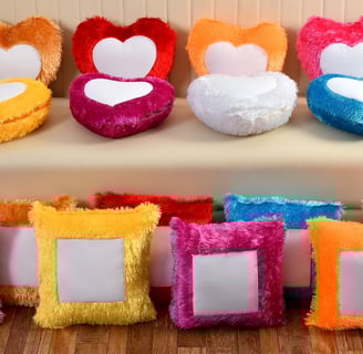 a couch with a bunch of pillows and a couch with a heart shaped picture frame