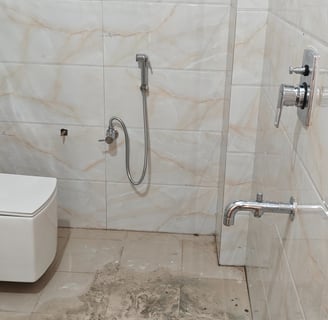 a bathroom with a toilet and a toilet paper towel