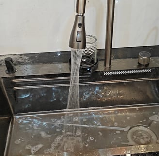 a kitchen sink with a faucet and a faucet faucet