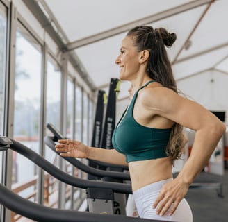 a woman in a green sports bra top and white shorts