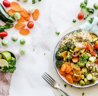 a plate of vegetables and vegetables on a table