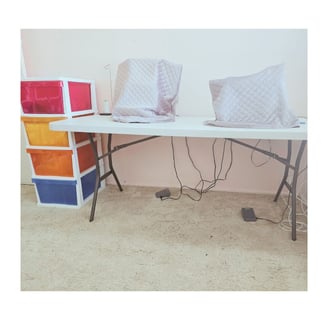 Marg’s neat sewing desk with machines set up & additional storage close by