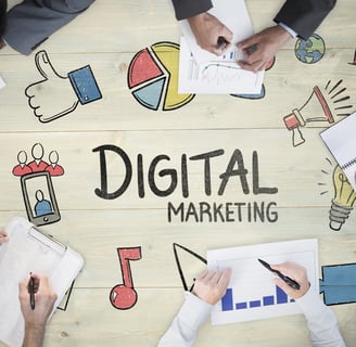 A table with colorful graphics surrounding the words "digital marketing"