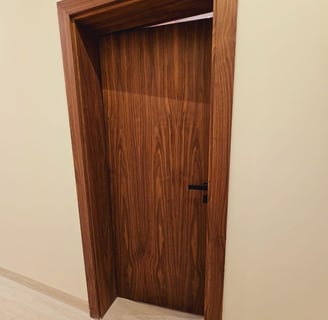 a door with a wooden door and a door handle