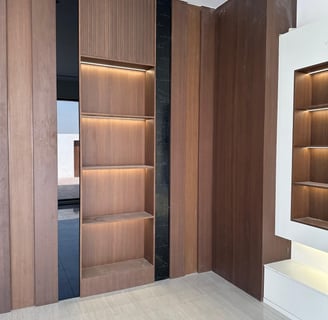 a room with a bookcase and a book shelf