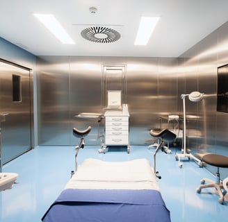 High-tech fertility clinic egg collection room with surgical chair and monitors
