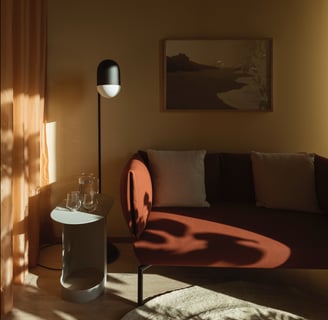 Warm, cozy consultation or lounge room with soft lighting and minimalist decor.