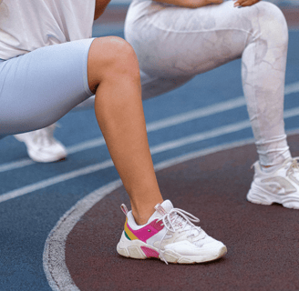 Women stretching as part of a fertility-friendly fitness routine
