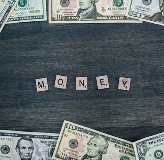 money spelled in wooden letters