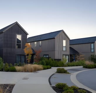 Modern townhouses in a landscaped neighborhood, representing residential property assessments