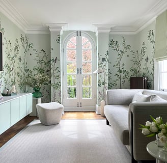 green vine floral wallpaper with green painted walls and neutral living room