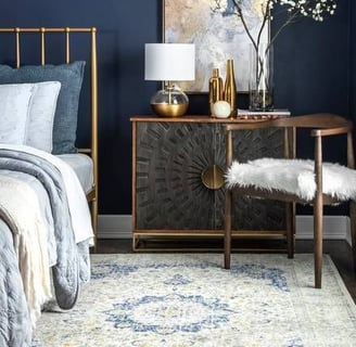 blue paint, blue rug and blue comforter with gold bed frame