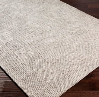 square printed neutral rug the rug is cream, linen, tan colored on dark hard wood floors
