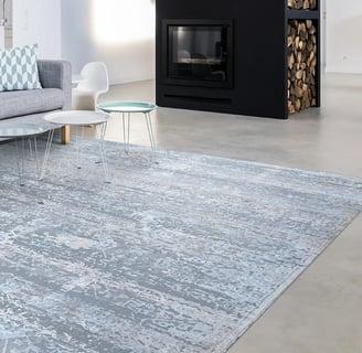 blue rug with a black fireplace