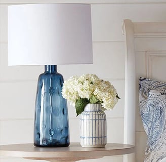 blue glass lamp base with white lamp shade