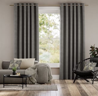 grey curtains with wood flooring