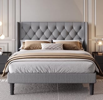 grey bed frame with grey and nude comforter