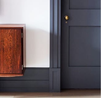 navy blue bedroom door with gold hardware 