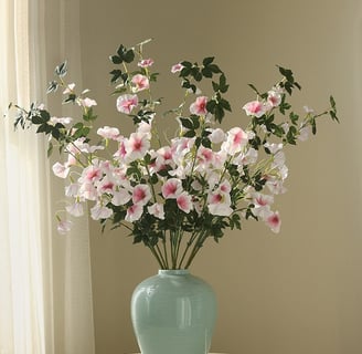 white and pink faux petunias in a vase