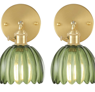 screw on green and gold flower shaped battery wall sconces on a white wallpaper