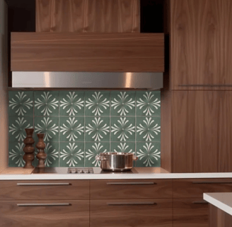 brown kitchen cabinets with green color patterned peel and stick back splash