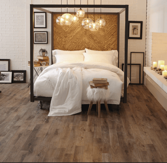 black bed frame with white comforter, dark wood peel and stick vinyl