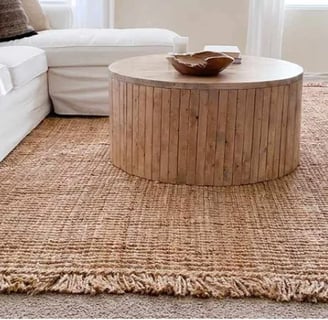 tan rug with white couch