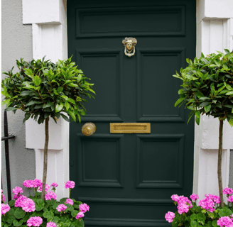 emerald green front door with gold hardware