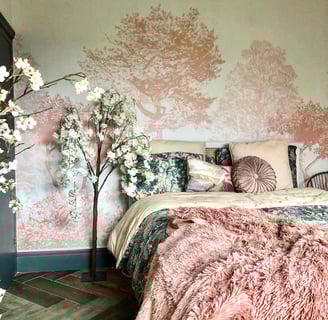 pink tree and white floral wallpaper with pink and green bedding with faux white flowers