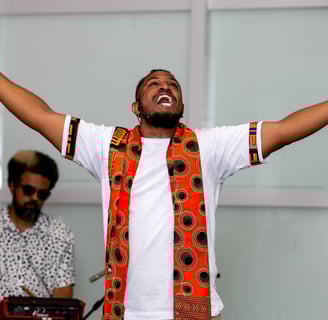 a man with a beard and a tie dye on his shirt