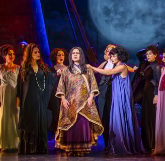 a group of people in costumes on stage