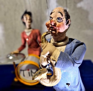 a couple of puppets of a man and a woman