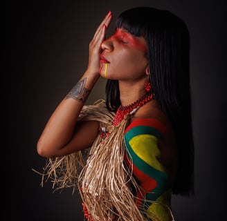 a woman with a colorful dress and a feathered headdress