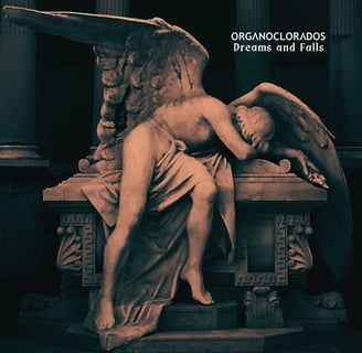 a statue of a angel with wings on a bench