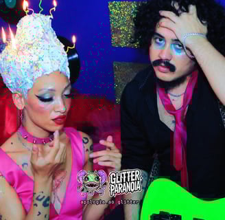 a man and woman in a party hat and a guitar