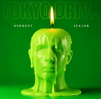 a candle with a candle in the middle of a green background